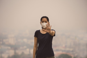 Fototapeta premium woman wearing a mask vent the outbreak of the virus concept for environmental pollution and health,medical.Insurance for your healthcare,disease,dust,smoke,dirt in the city