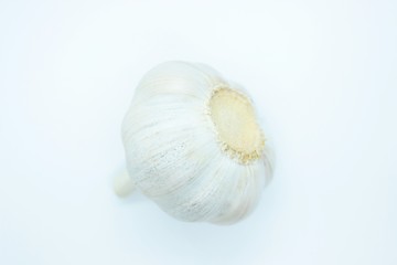 A head of garlic located on a white background