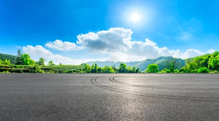 Foto op Aluminium Race track road and green tea plantation nature landscape. © ABCDstock