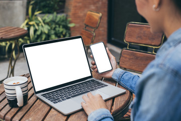 computer,cell phone mockup image blank screen with white background for advertising text,hand woman...