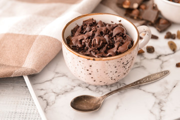 Tray with chocolate mug cake on table, closeup
