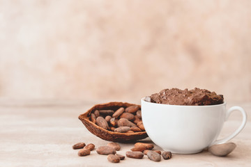 Chocolate mug cake on grey background