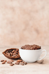 Chocolate mug cake on grey background