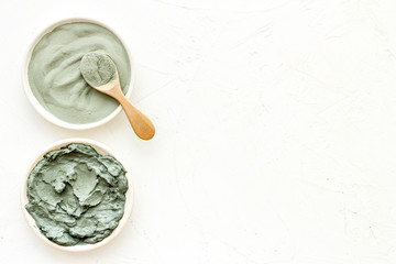 Blue cosmetic clay on white background top-down copy space