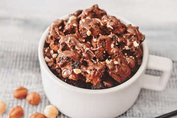 Chocolate mug cake on table, closeup