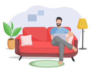 Work at home. Young man working with laptop on couch. Freelancer, online education or social media concept.
