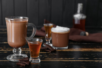 Cup of alcohol hot chocolate on table