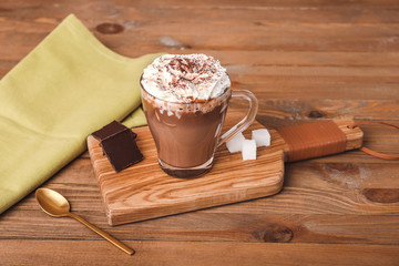 Cup of hot chocolate on table