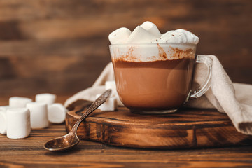 Cup of hot chocolate with marshmallows on table