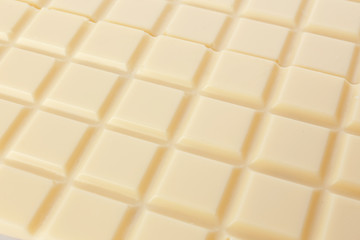 Sweet white chocolate as background, closeup