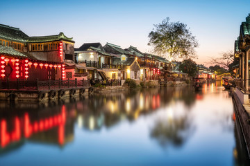 Fototapeta na wymiar Beautiful night view and houses along the river in Xitang ancient town, Zhejiang Province..