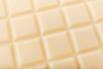 Sweet white chocolate as background, closeup