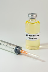 Coronavirus vaccine in medical bottle on white background 