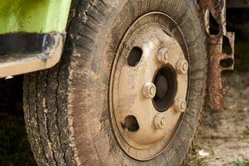 Fototapeta na wymiar closeup of Dirty truck tire on the parking area