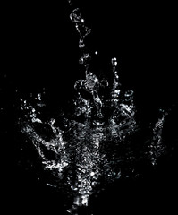 Splashes and drops of water are on a black background.