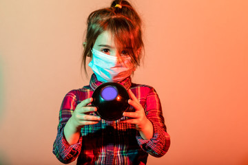 Little girl has fabric mask protect herself from Coronavirus COVID-19