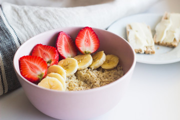Tasty breakfast. Oatmeal with banana and strawberries