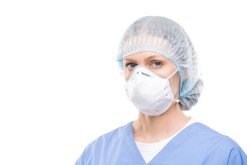 Contemporary young female doctor or nurse in protective mask and uniform