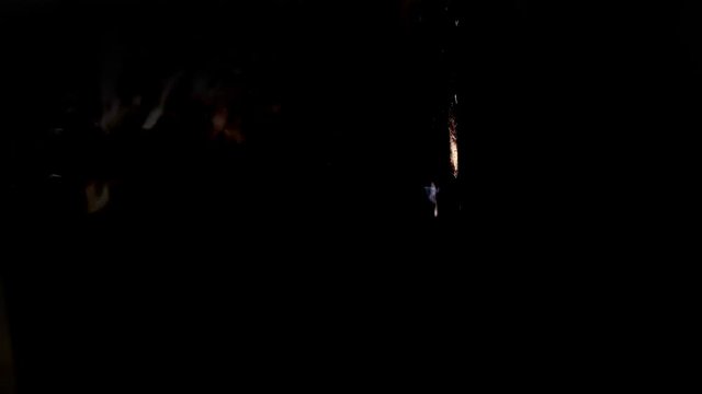 Texture of a shot into a wall, bulletproof vest from a firearm, through penetration of an obstacle by an incendiary projectile, the bullet breaks through the barrier in slow motion
