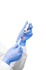 Gloved virologist taking anti covid19 vaccine from small bottle into syringe