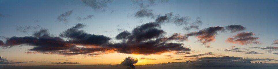 Fantastic dark thunderclouds at sunrise