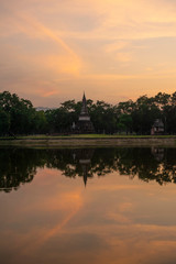 Fototapeta na wymiar sunset temple over lake
