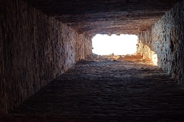 Fototapeta na wymiar Low angle view of brick interior of temple in Cambodia