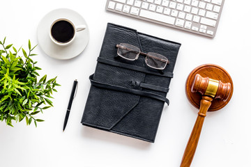 Judge gavel near documents and keyboard - desk of contemporary lawyer - on white background top-down