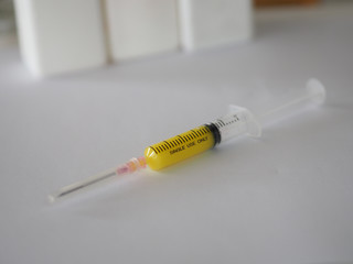 syringe has a sharp needle on white background