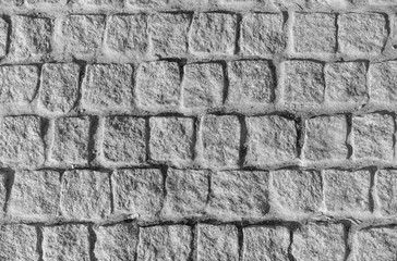 Wall of brick blocks in gray, for design or as a natural background.