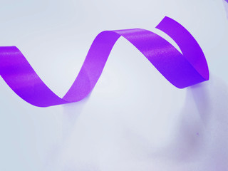 Purple blue ribbon on light blue background