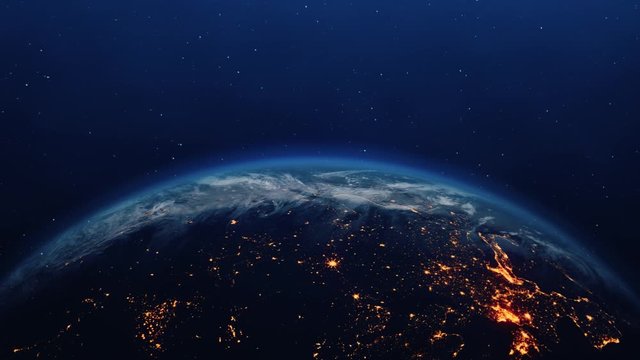 The Night seen of Planet Earth City Lights from the International Space Station space clouds . Sunsire 4K Loop Animation. Space, Planet, Galaxy, Stars, Cosmos, Sea, Earth, Sunset, Globe, World.
