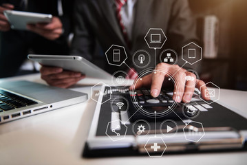 Teamwork process, Business team using a calculator to calculate the numbers of statistic business profits growth rate on documents graph data, desk in a office.