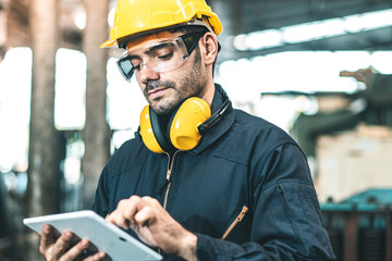 Industrial Engineers in Hard Hats.Work at the Heavy Industry Manufacturing Factory.industrial...