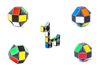 Set of toy colorful snake puzzles in shape of balls and dog on white background. Full size.