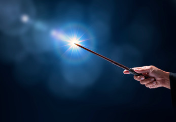 Magic wand with sparkle on miracle background, Miracle magical stick Wizard tool on hot background. - obrazy, fototapety, plakaty