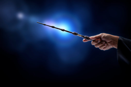 Magic wand with sparkle on miracle background, Miracle magical stick Wizard tool on hot background.