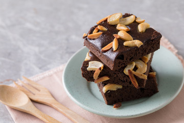 Chocolate brownie cake sprinkle with almonds and cashews.