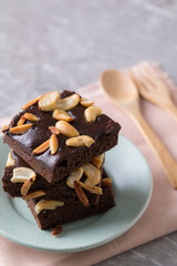 Chocolate brownie cake sprinkle with almonds and cashews.