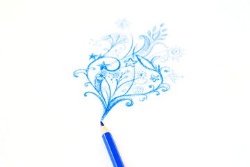 blue pencil draws patterns and smoke