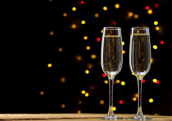 Close-up of two glasses with bubbly champagne