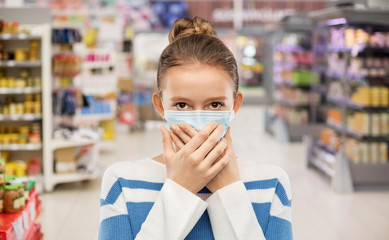 health protection, safety and pandemic concept - teenage girl in protective medical mask over...