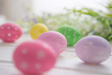 Easter eggs on a white wooden surface