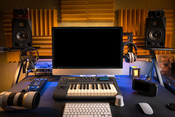 Workplace of professional musician or photographer at home. A lot of different equipment on the table