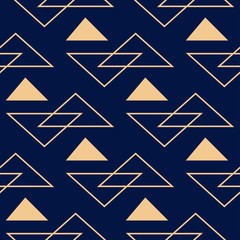 Obraz premium Geometric seamless design. Golden triangle pattern on dark blue background