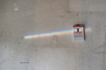 Chinese calendar on the wall with across reflect rainbow