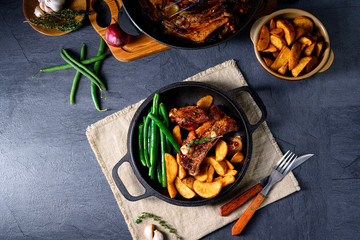 Rib of pork with beans and quarter potato