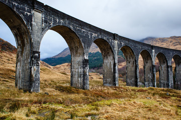 Fototapeta na wymiar Arches of Glenfinnan train viaduct in a scottish autumn