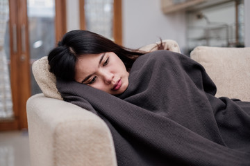 Fototapeta premium Portrait of a sleeping sick flu young woman asian at home. Pandemic 2019 Coronavirus 2019-nCoV Concept.