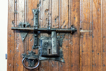 old wooden door with metal lock